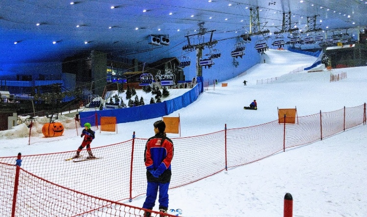 Kids enjoy ski diving in Ski Dubai