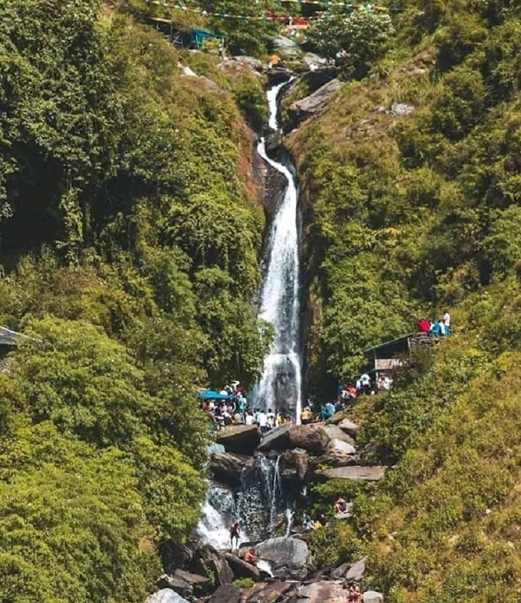 Embark on a scenic hike along hill paths to explore stunning waterfalls and lakes
